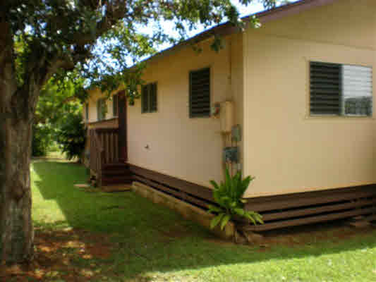 4910 Aliali Road Kapaa, HI 96746 - Photo 3 of 19 a house that has a tree in it