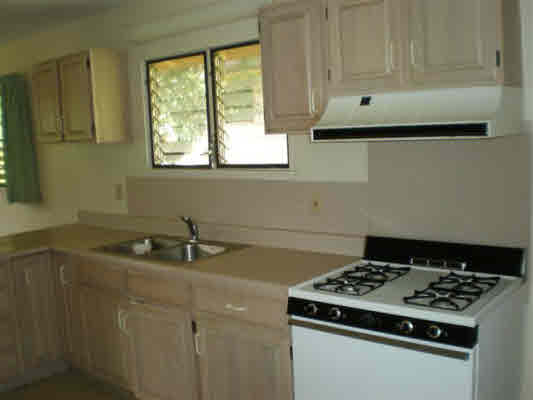 4910 Aliali Road Kapaa, HI 96746 - Photo 8 of 19 a kitchen with granite countertop a sink stove and cabinets