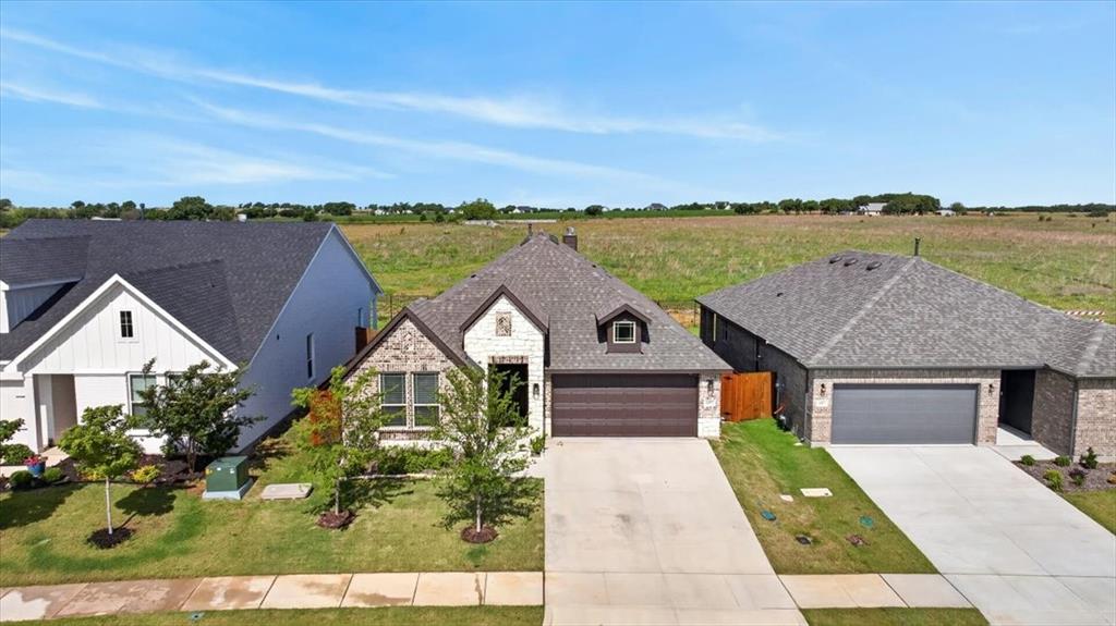 653 Godley Ranch Godley, TX 76044 - Photo 33 of 35 an aerial view of a house with big yard and large tree
