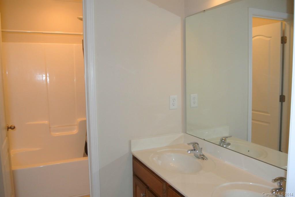 11020 Greenhead View Road Charlotte, NC 28262 - Photo 12 of 18 a bathroom with a sink and a mirror