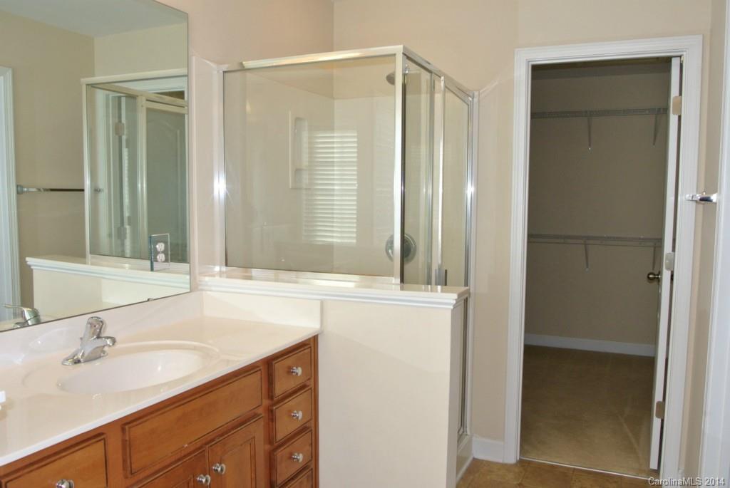 11020 Greenhead View Road Charlotte, NC 28262 - Photo 14 of 18 a bathroom with a sink and a mirror