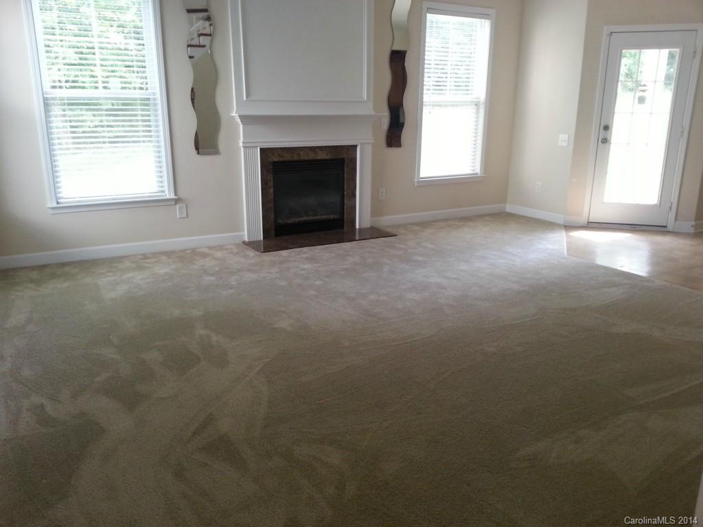 11020 Greenhead View Road Charlotte, NC 28262 - Photo 5 of 18 a view of empty room with a fireplace