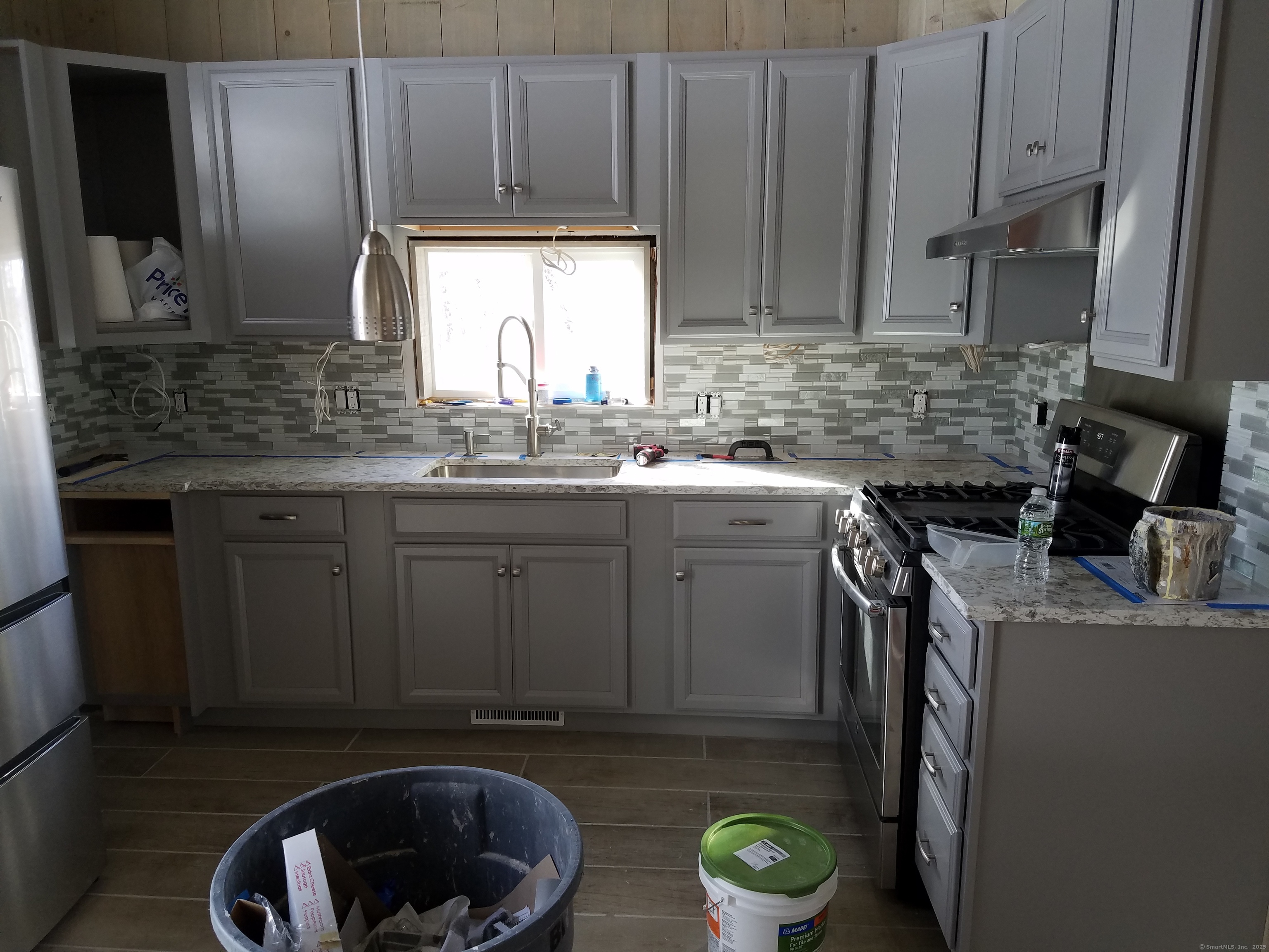 134 Nashville Road Bethel, CT 06801 - Photo 15 of 36 a kitchen with stainless steel appliances granite countertop a sink stove and cabinets