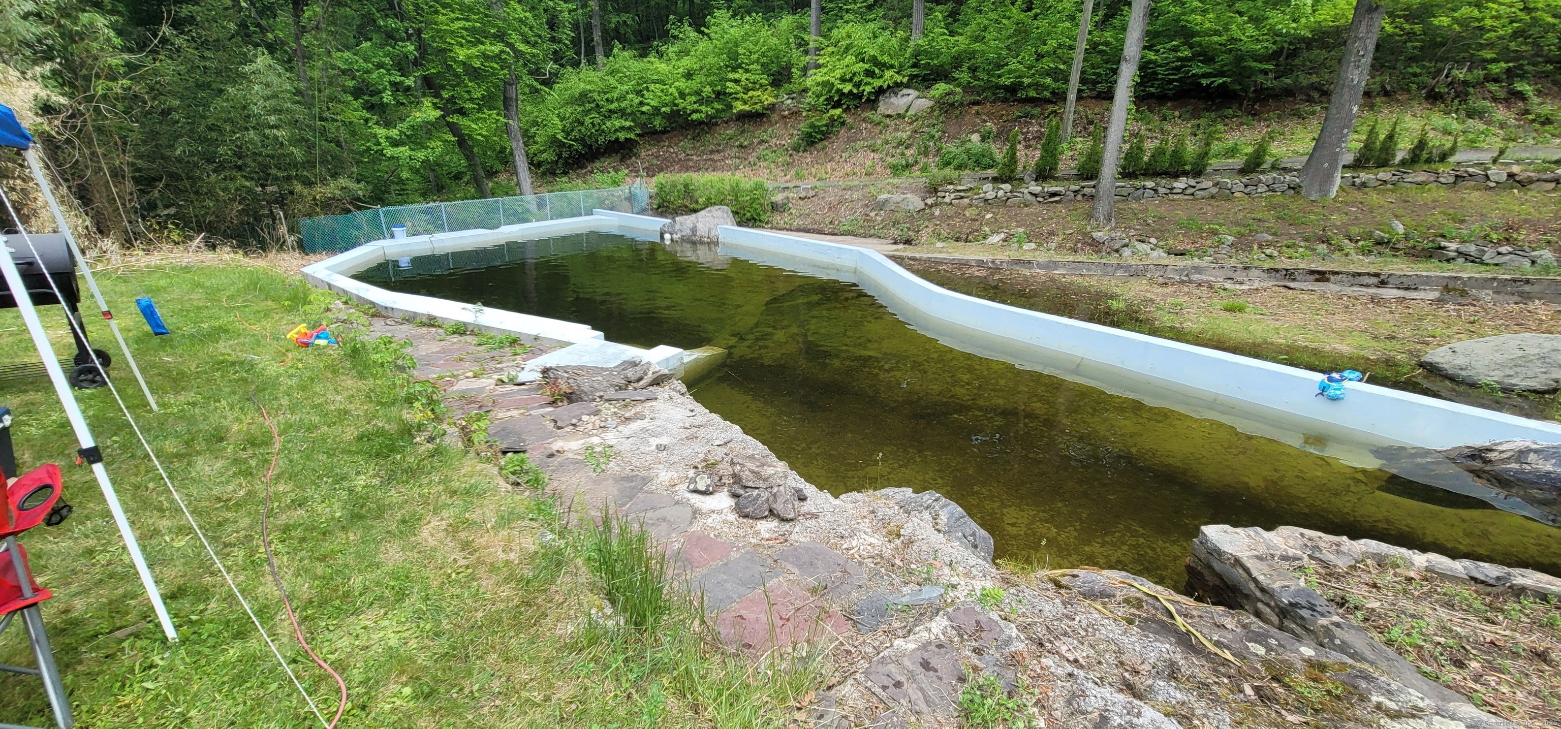 134 Nashville Road Bethel, CT 06801 - Photo 6 of 36 a view of a lake from a yard