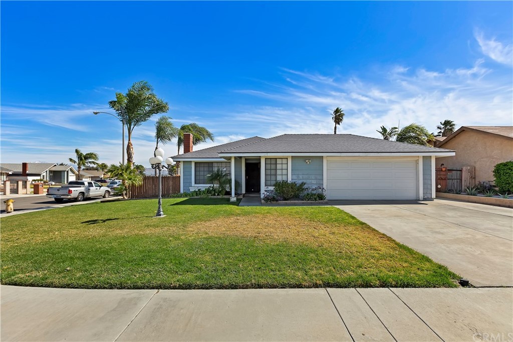 7236 Idyllwild Lane Riverside, CA 92503 - Photo 1 of 1 a front view of a house with a garden and yard