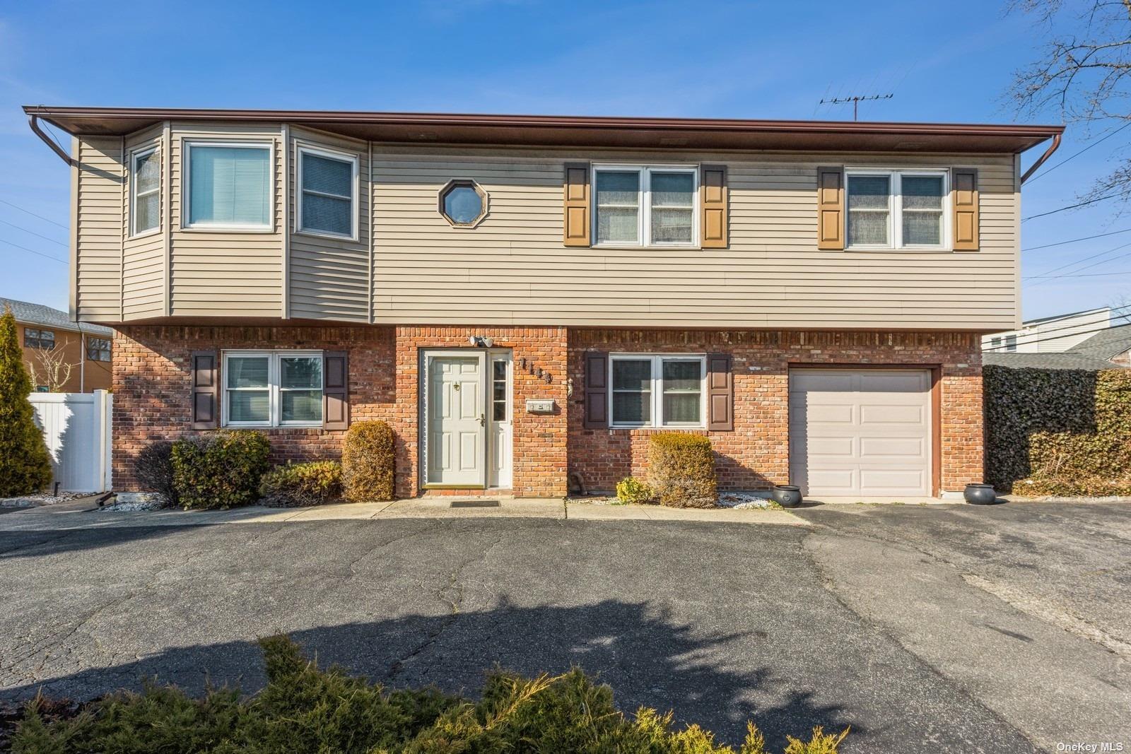 1144 Hicksville Road Massapequa, NY 11758 - Photo 1 of 1 a front view of a house