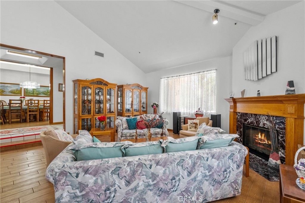 52 Hidden Valley Road Monrovia, CA 91016 - Photo 11 of 55 a living room with furniture fireplace and a large window