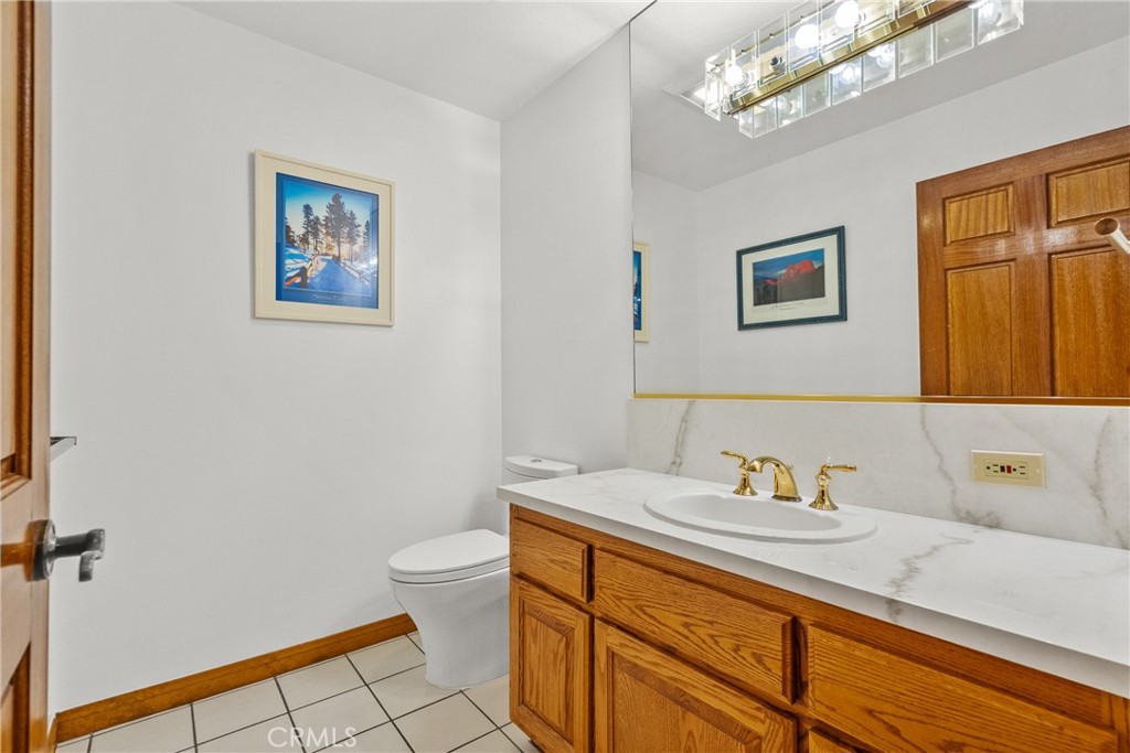 52 Hidden Valley Road Monrovia, CA 91016 - Photo 15 of 55 a bathroom with a sink a toilet and mirror