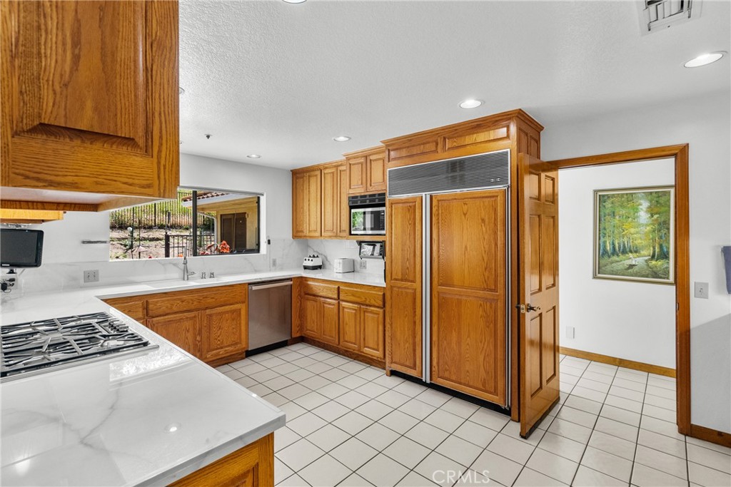 52 Hidden Valley Road Monrovia, CA 91016 - Photo 19 of 55 a kitchen with stainless steel appliances granite countertop a refrigerator and a sink