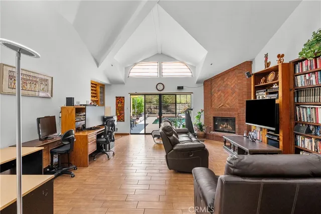 a living room with furniture fireplace and a flat screen tv