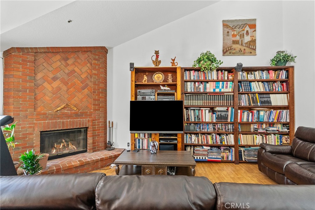 52 Hidden Valley Road Monrovia, CA 91016 - Photo 27 of 55 a living room with furniture fireplace and a flat screen tv