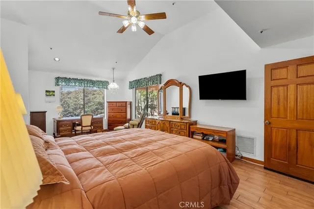 a bedroom with a bed and a large window