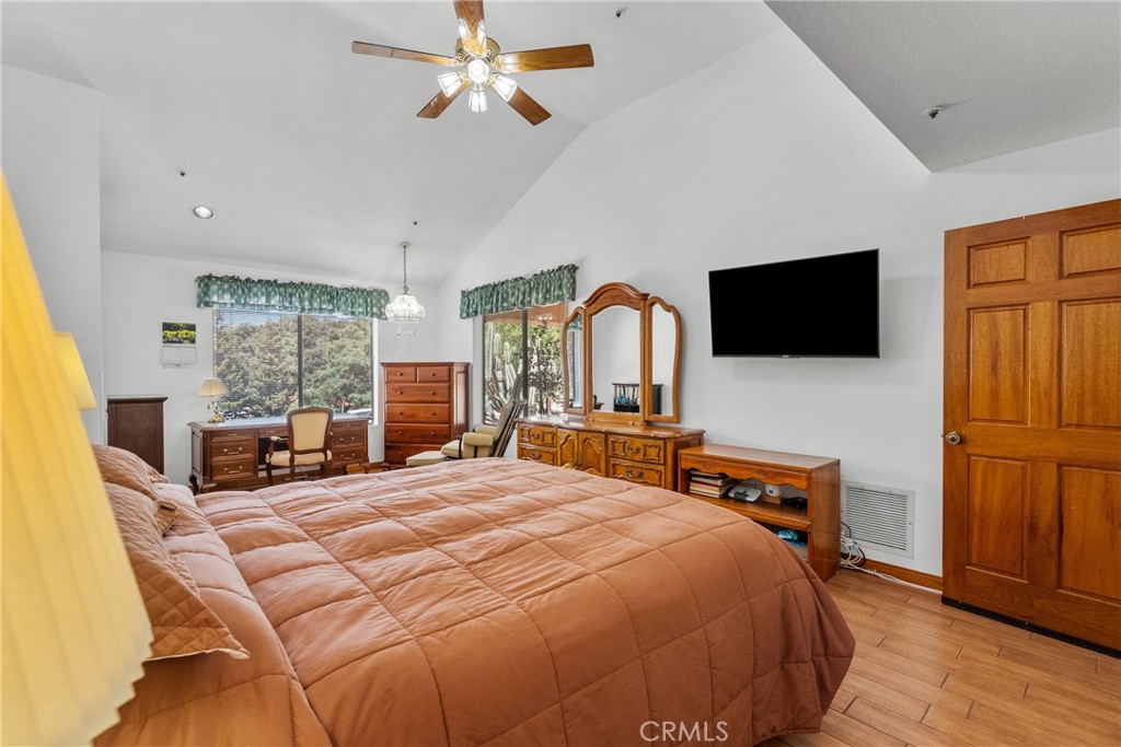 52 Hidden Valley Road Monrovia, CA 91016 - Photo 30 of 55 a bedroom with a bed a flat screen tv and windows