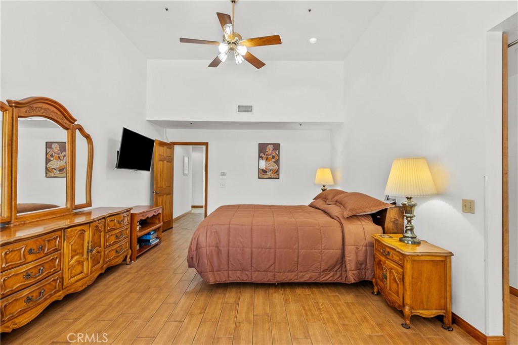 52 Hidden Valley Road Monrovia, CA 91016 - Photo 31 of 55 a bedroom with a bed and wooden floor