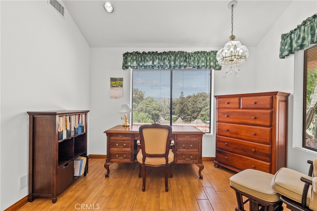 52 Hidden Valley Road Monrovia, CA 91016 - Photo 32 of 55 a dining room with furniture a chandelier and wooden floor