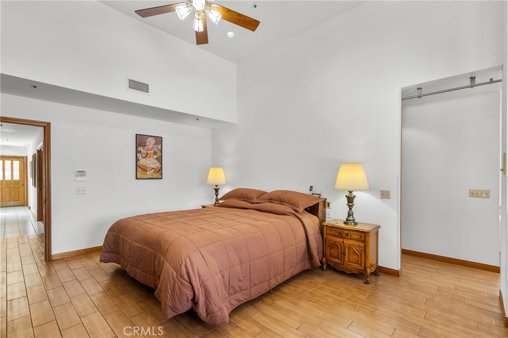 52 Hidden Valley Road Monrovia, CA 91016 - Photo 34 of 55 a bedroom with a bed and a chandelier