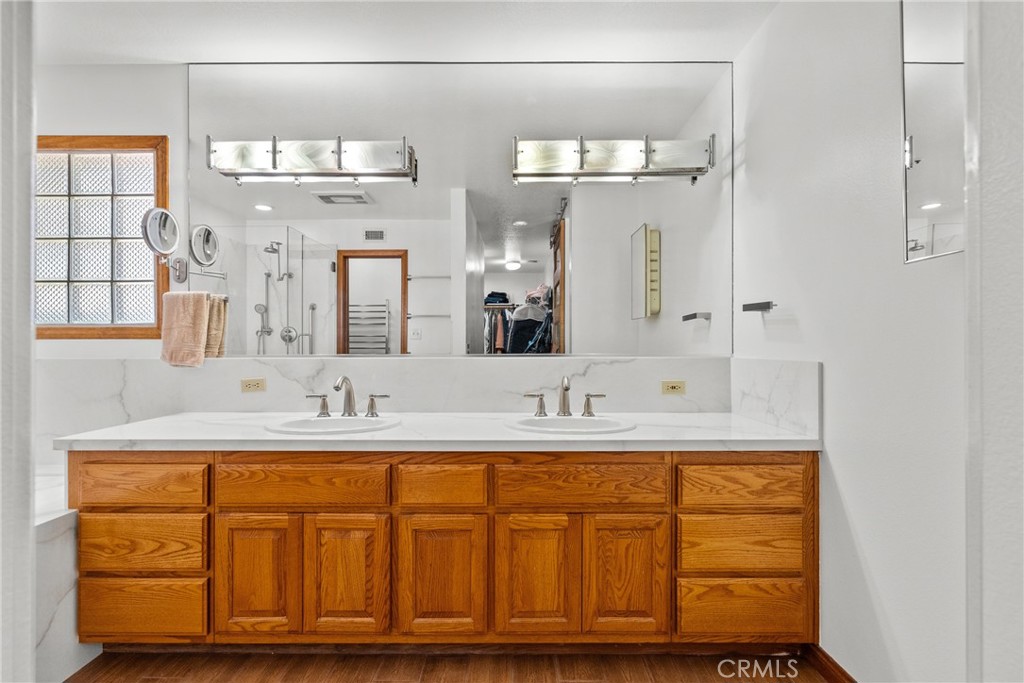 52 Hidden Valley Road Monrovia, CA 91016 - Photo 35 of 55 a bathroom with a double vanity sink and a mirror