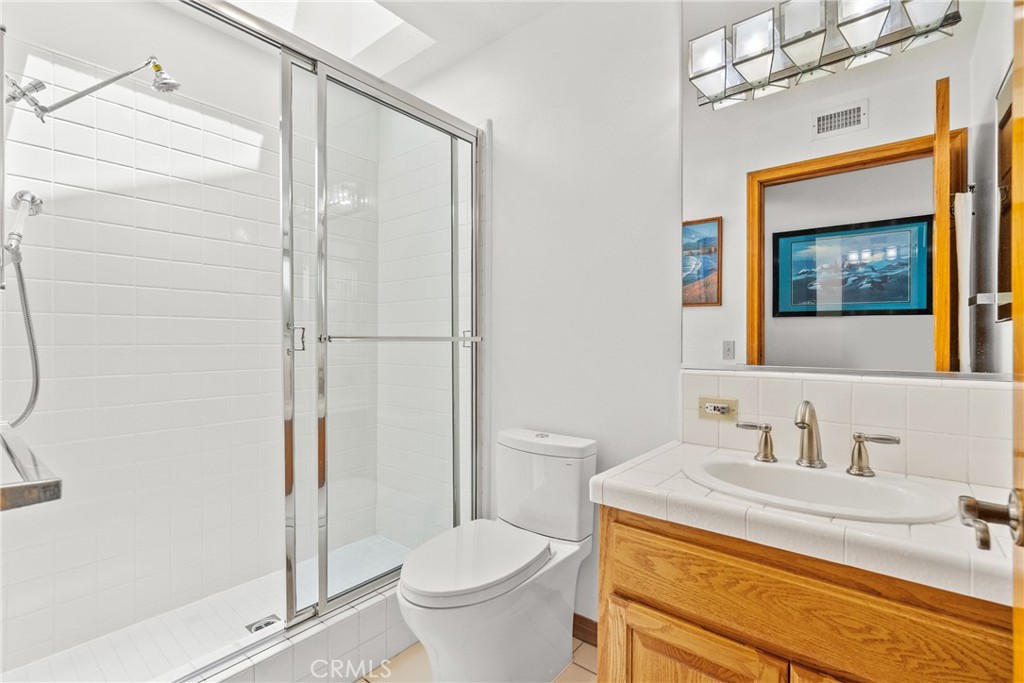 52 Hidden Valley Road Monrovia, CA 91016 - Photo 41 of 55 a bathroom with a granite countertop sink toilet and shower