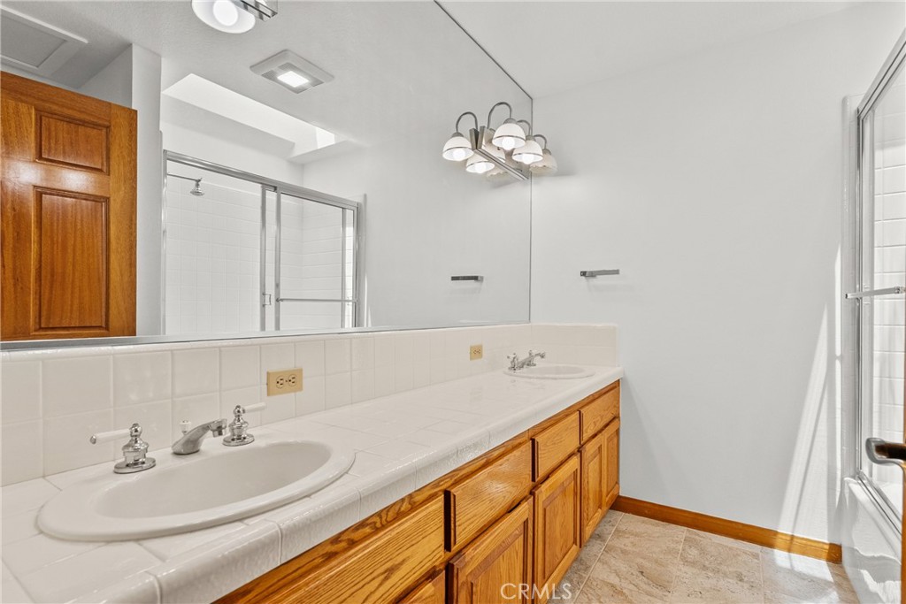 52 Hidden Valley Road Monrovia, CA 91016 - Photo 42 of 55 a bathroom with a sink a vanity and mirror