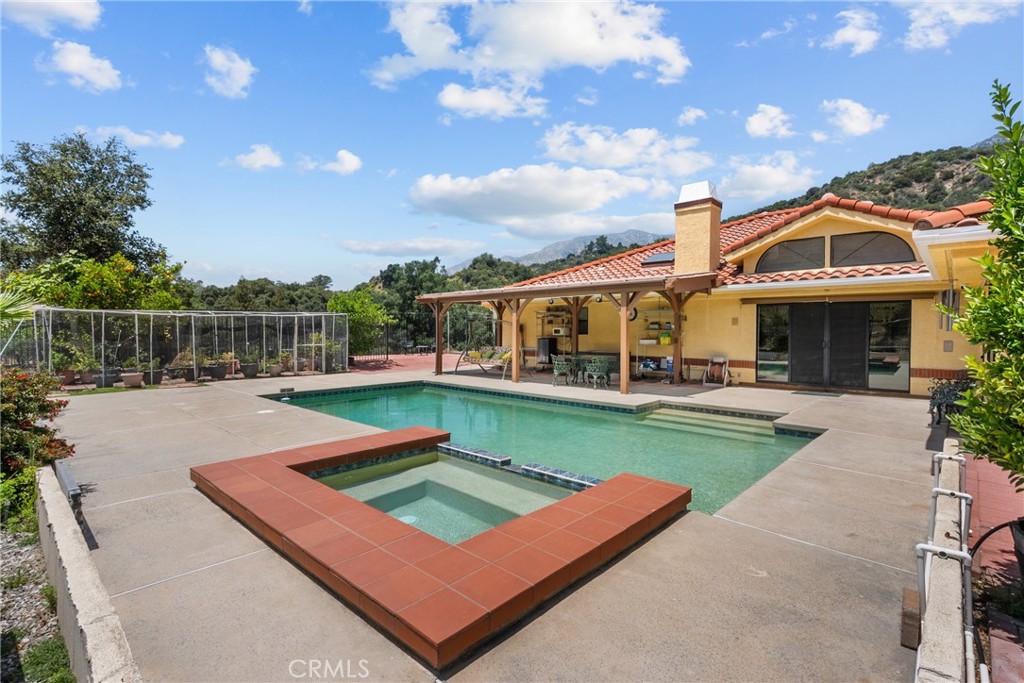 52 Hidden Valley Road Monrovia, CA 91016 - Photo 45 of 55 a view of a house with pool and chairs