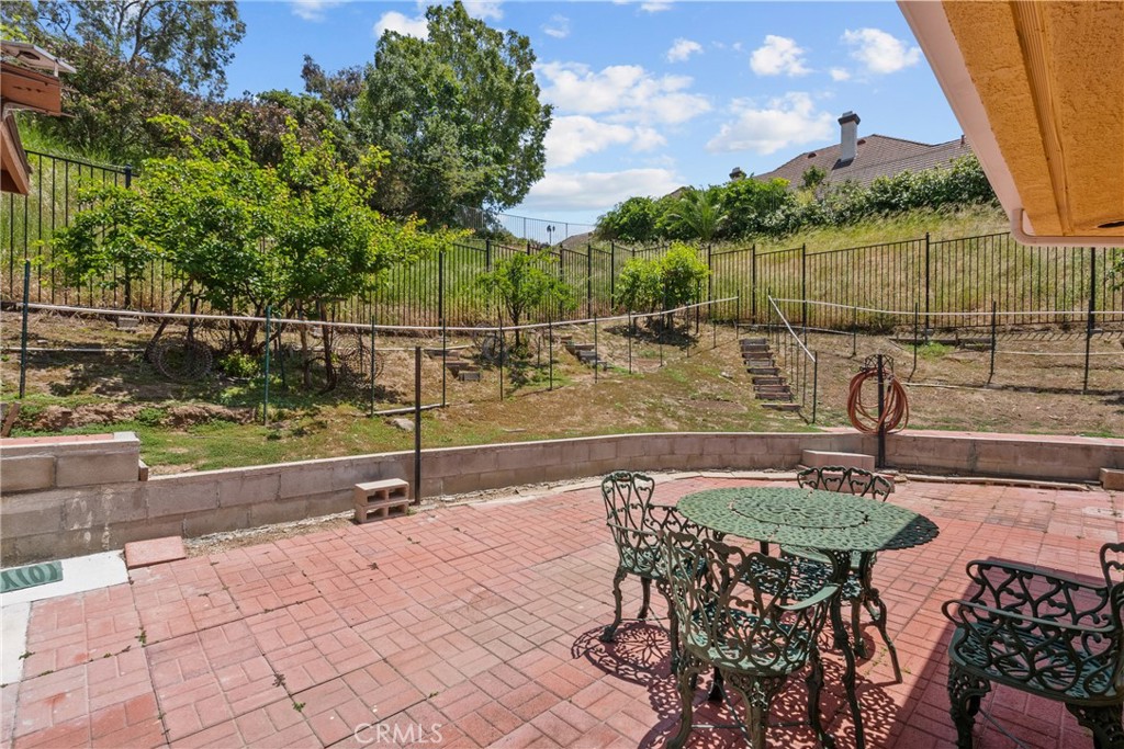 52 Hidden Valley Road Monrovia, CA 91016 - Photo 49 of 55 a backyard of a house with table and chairs