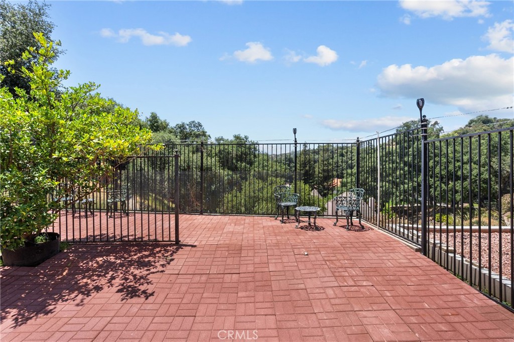 52 Hidden Valley Road Monrovia, CA 91016 - Photo 50 of 55 a view of a patio with a table and chairs with wooden fence