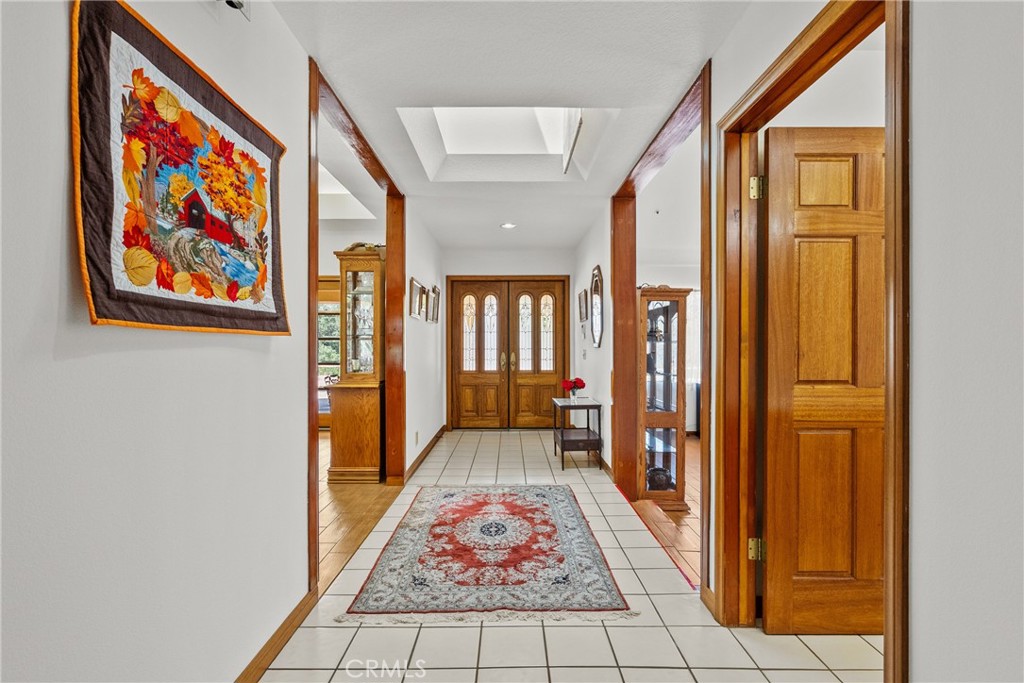 52 Hidden Valley Road Monrovia, CA 91016 - Photo 9 of 55 a view of a hallway with wooden floor and furniture