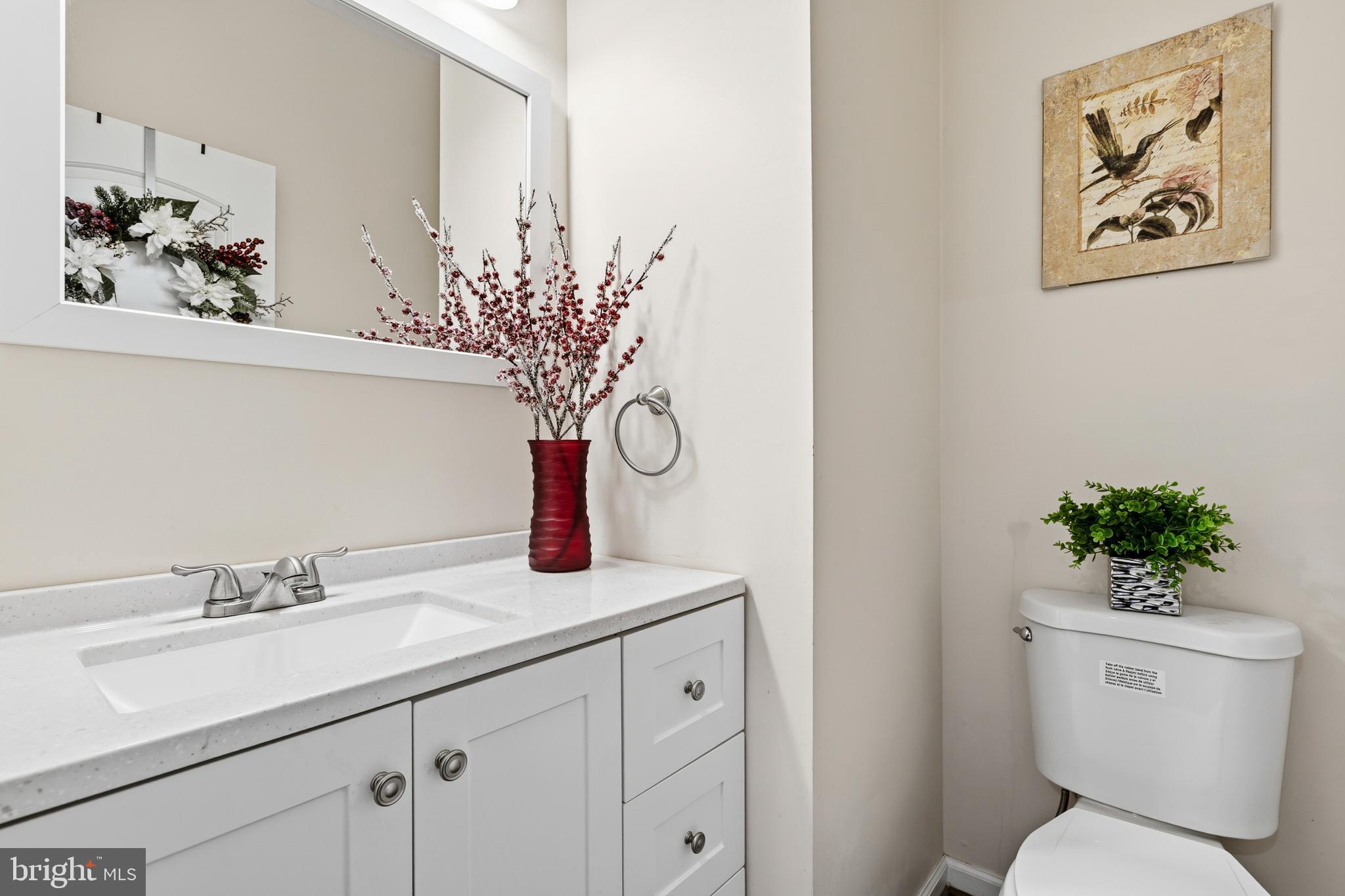 4285 South Capitol Street Southwest Washington, DC 20032 - Photo 13 of 24 a bathroom with a toilet sink and mirror
