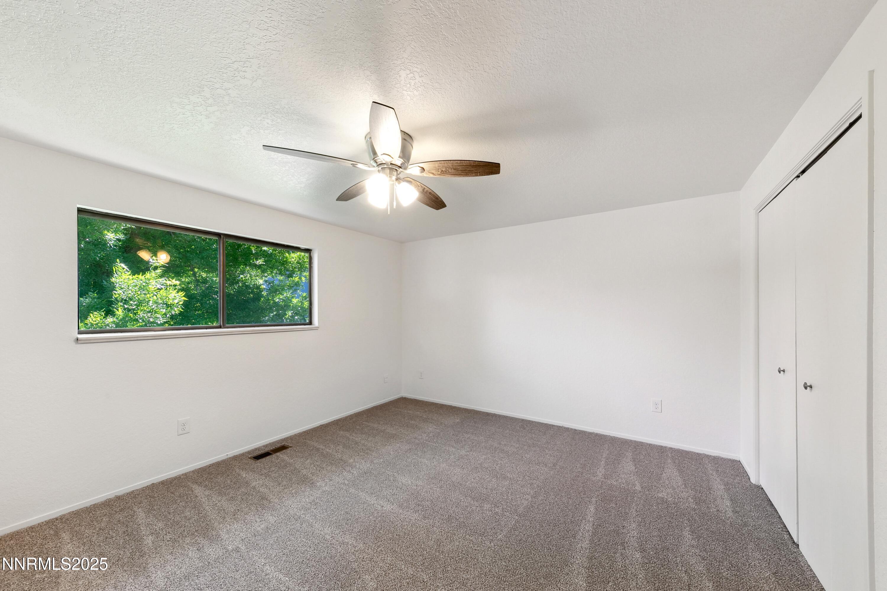718 Travis Drive, Unit D Carson City, NV 89701 - Photo 16 of 19 an empty room with a window
