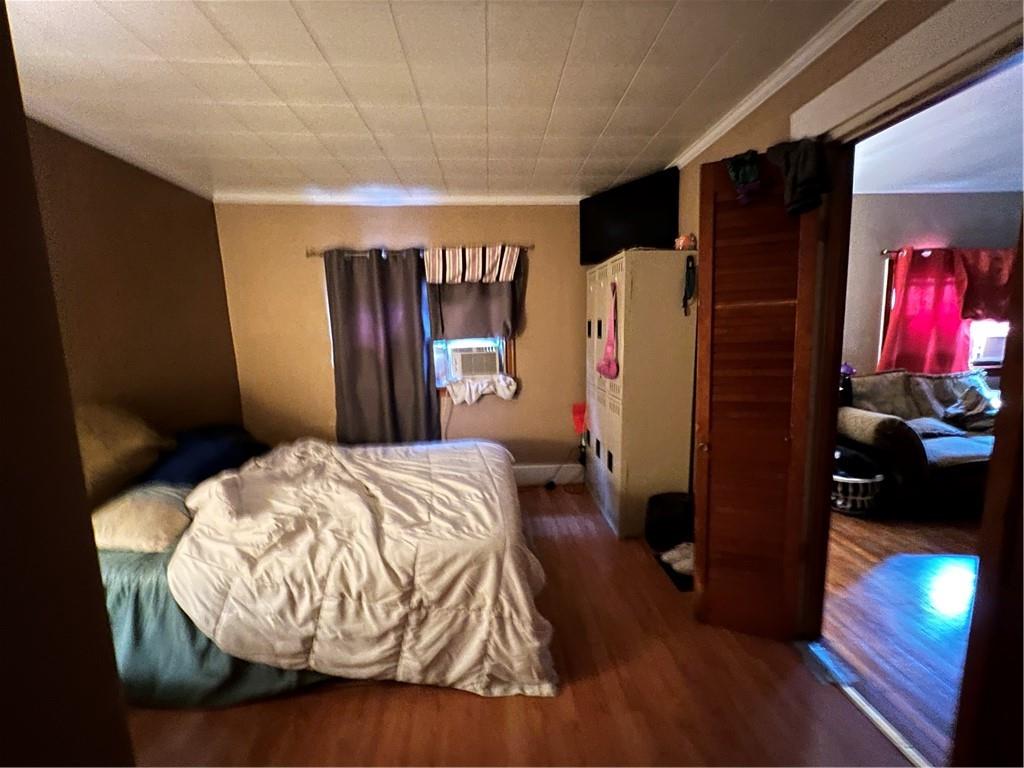 442 East Washington Street Rochester, PA 15074 - Photo 12 of 23 a bed sitting in a bedroom next to a window