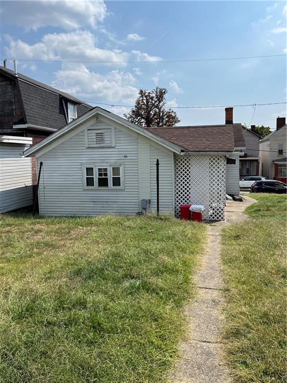 442 East Washington Street Rochester, PA 15074 - Photo 22 of 23 a front view of a house with a yard