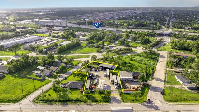 an aerial view of residential houses with outdoor space and street view