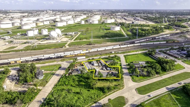 a view of a swimming pool with a lot of plants and trees