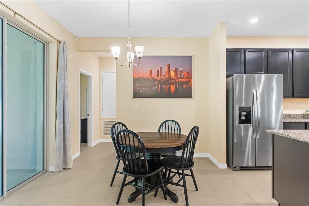 6283 Grapewood Road Spring Hill, FL 34609 - Photo 27 of 41 a view of a dining room with furniture