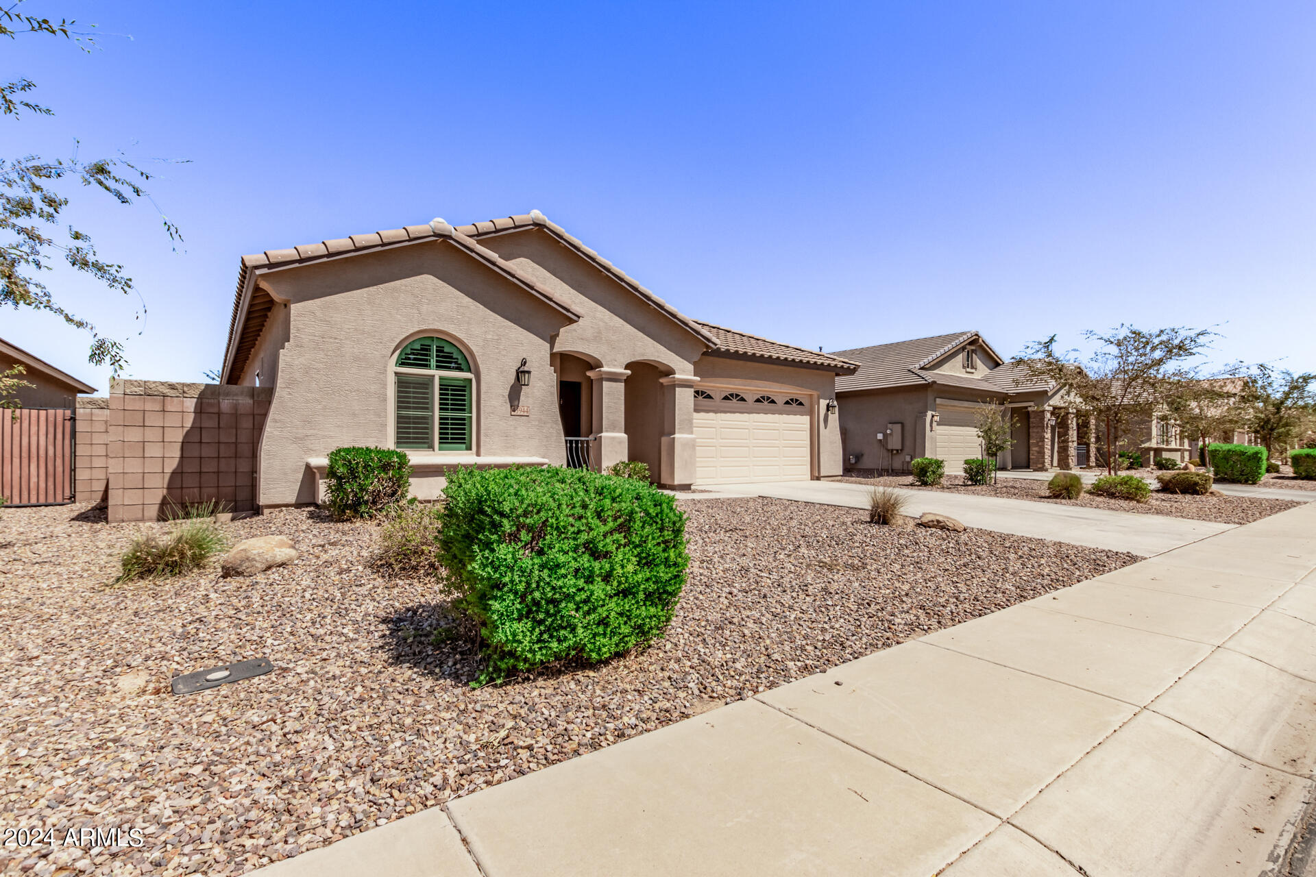 43944 Stonecreek Road Maricopa, AZ 85139 - Photo 1 of 62 a front view of a house with a yard and garage