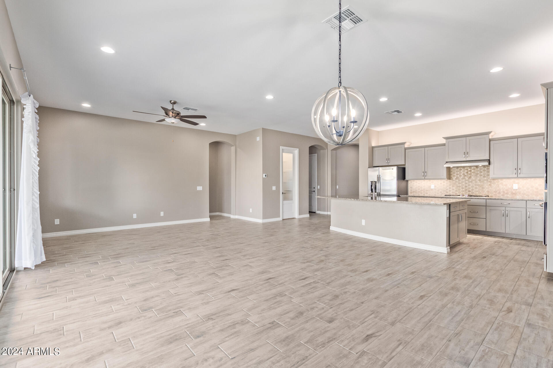 43944 Stonecreek Road Maricopa, AZ 85139 - Photo 14 of 62 a view of a kitchen with a sink and dishwasher in it