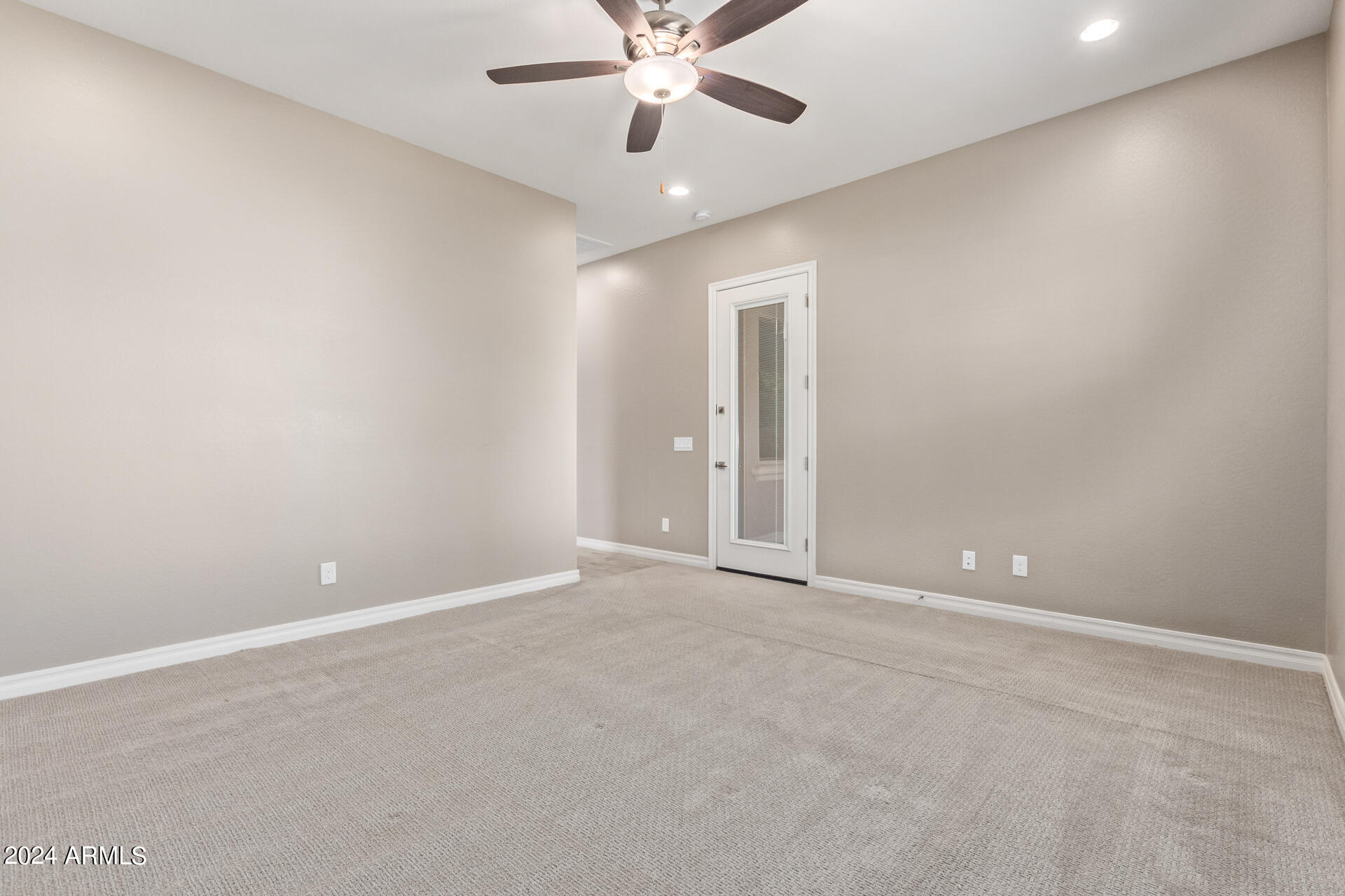 43944 Stonecreek Road Maricopa, AZ 85139 - Photo 25 of 62 a view of an empty room with a ceiling fan