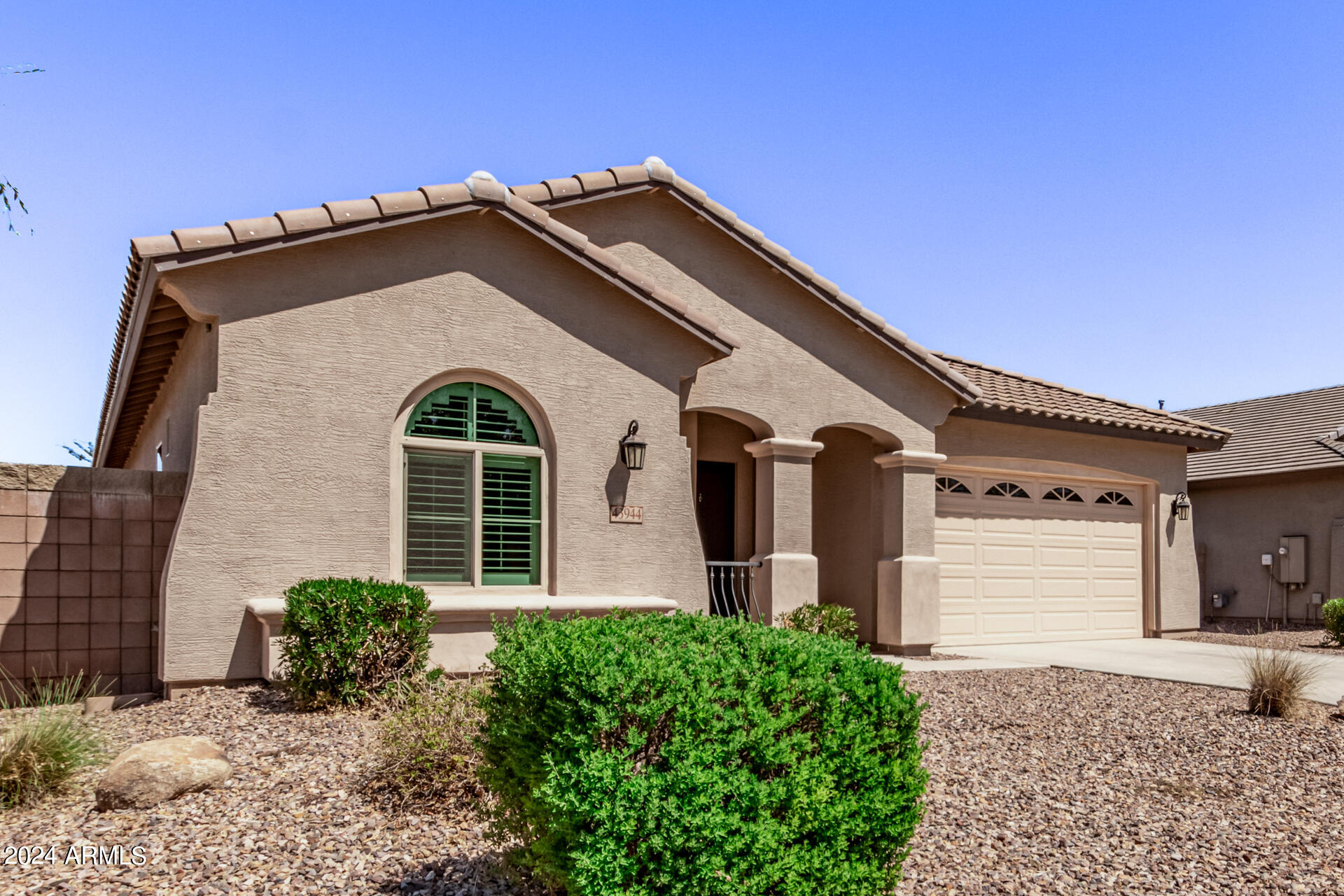 43944 Stonecreek Road Maricopa, AZ 85139 - Photo 3 of 62 a front view of a house with a yard