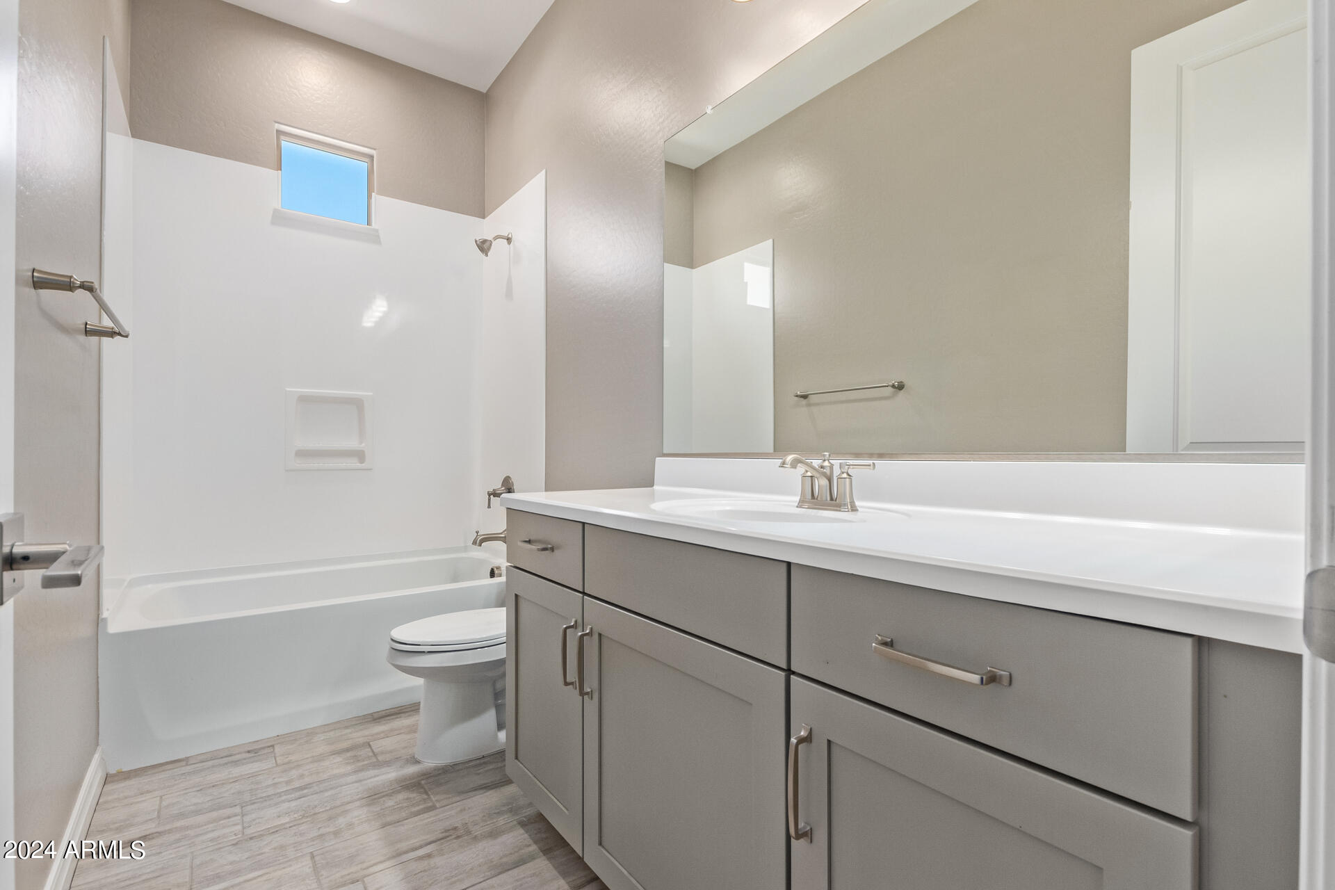 43944 Stonecreek Road Maricopa, AZ 85139 - Photo 38 of 62 a bathroom with a double vanity sink toilet mirror and bathtub