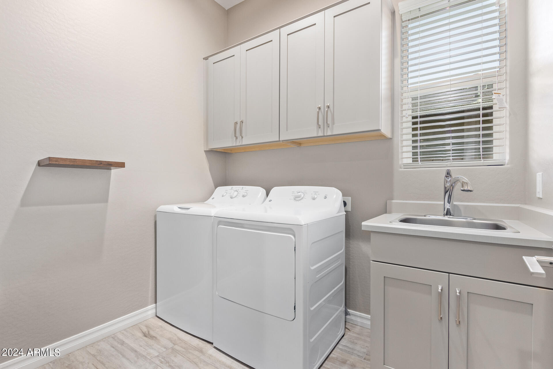 43944 Stonecreek Road Maricopa, AZ 85139 - Photo 40 of 62 a utility room with dryer and washer