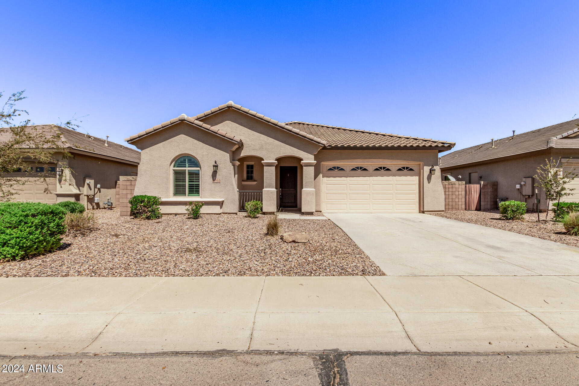 43944 Stonecreek Road Maricopa, AZ 85139 - Photo 4 of 62 a front view of a house with garage