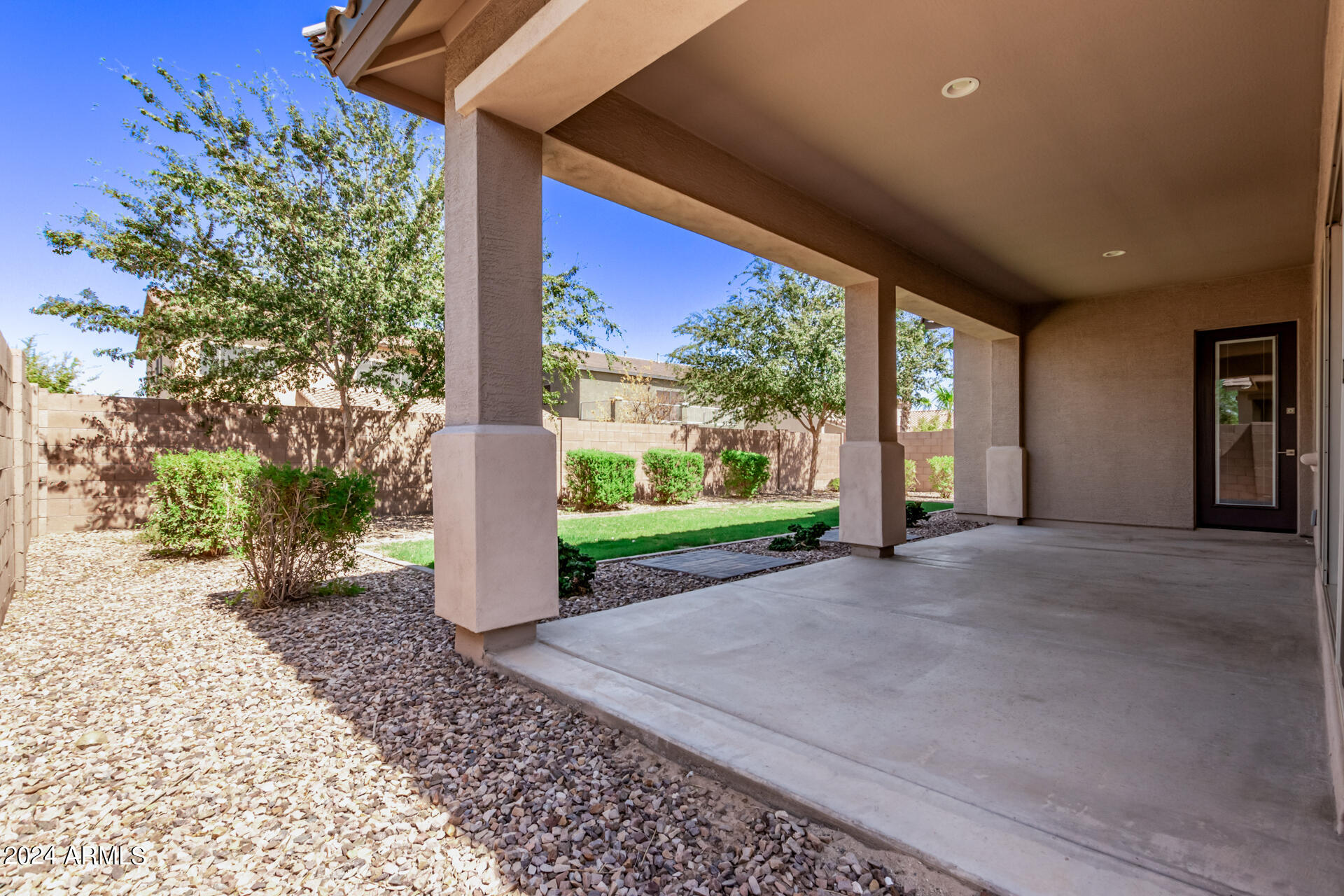 43944 Stonecreek Road Maricopa, AZ 85139 - Photo 43 of 62 a view of a porch with a garden