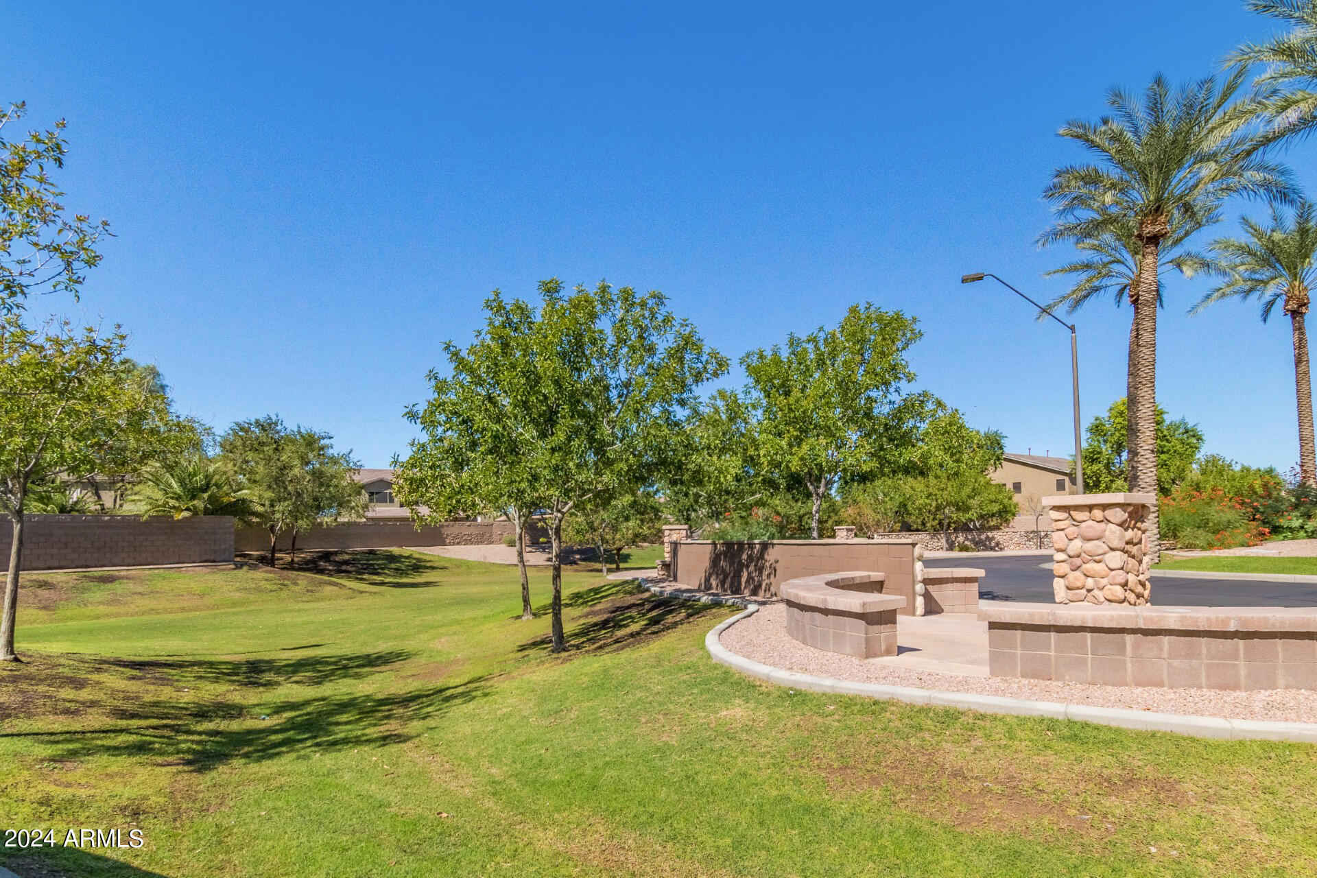 43944 Stonecreek Road Maricopa, AZ 85139 - Photo 45 of 62 a view of a swimming pool with a garden