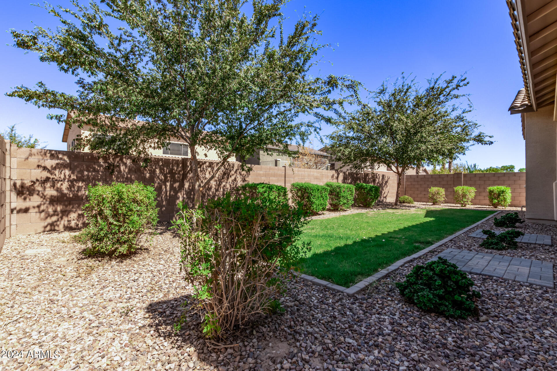 43944 Stonecreek Road Maricopa, AZ 85139 - Photo 46 of 62 a view of a garden with a tree
