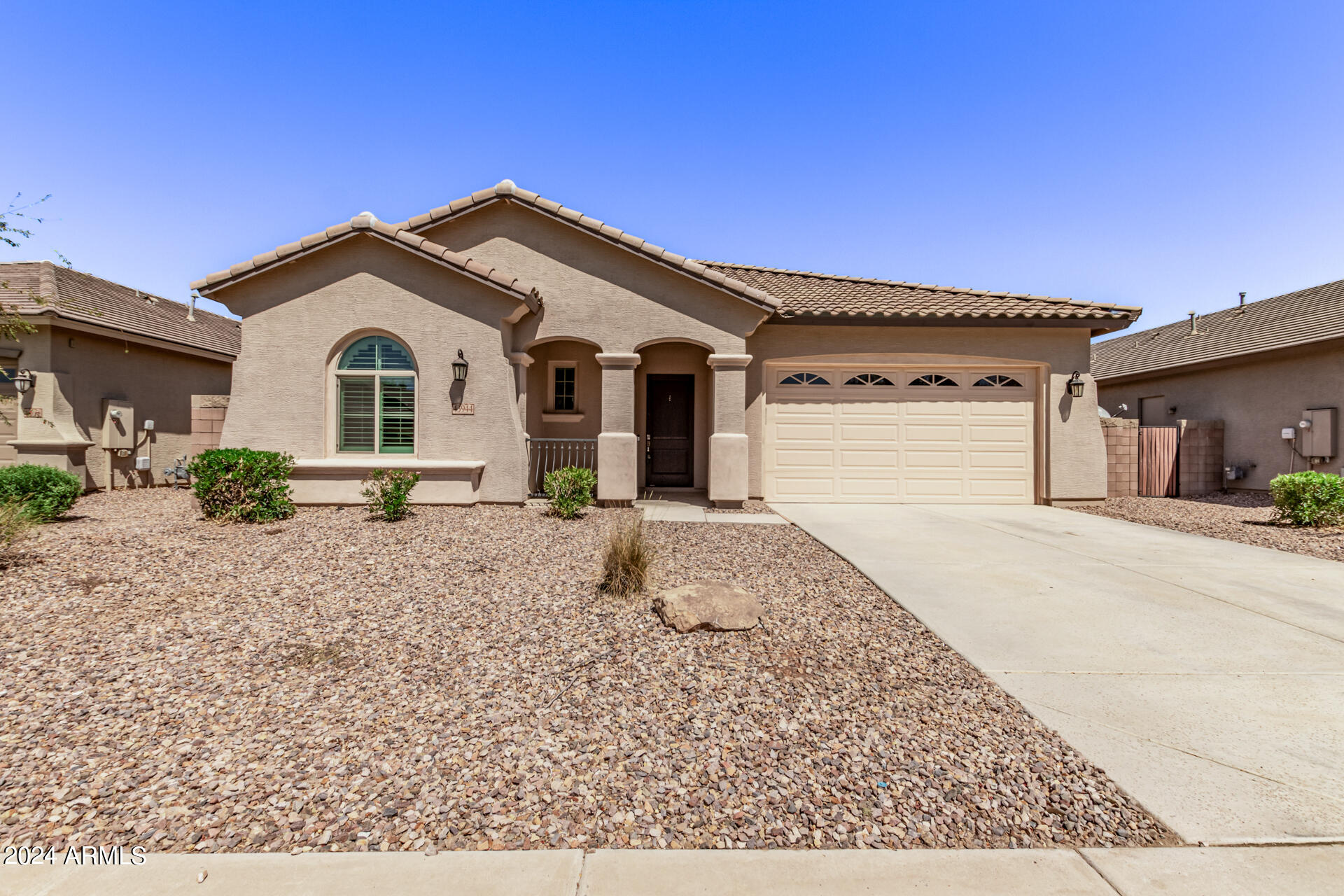 43944 Stonecreek Road Maricopa, AZ 85139 - Photo 5 of 62 a front view of a house with a yard