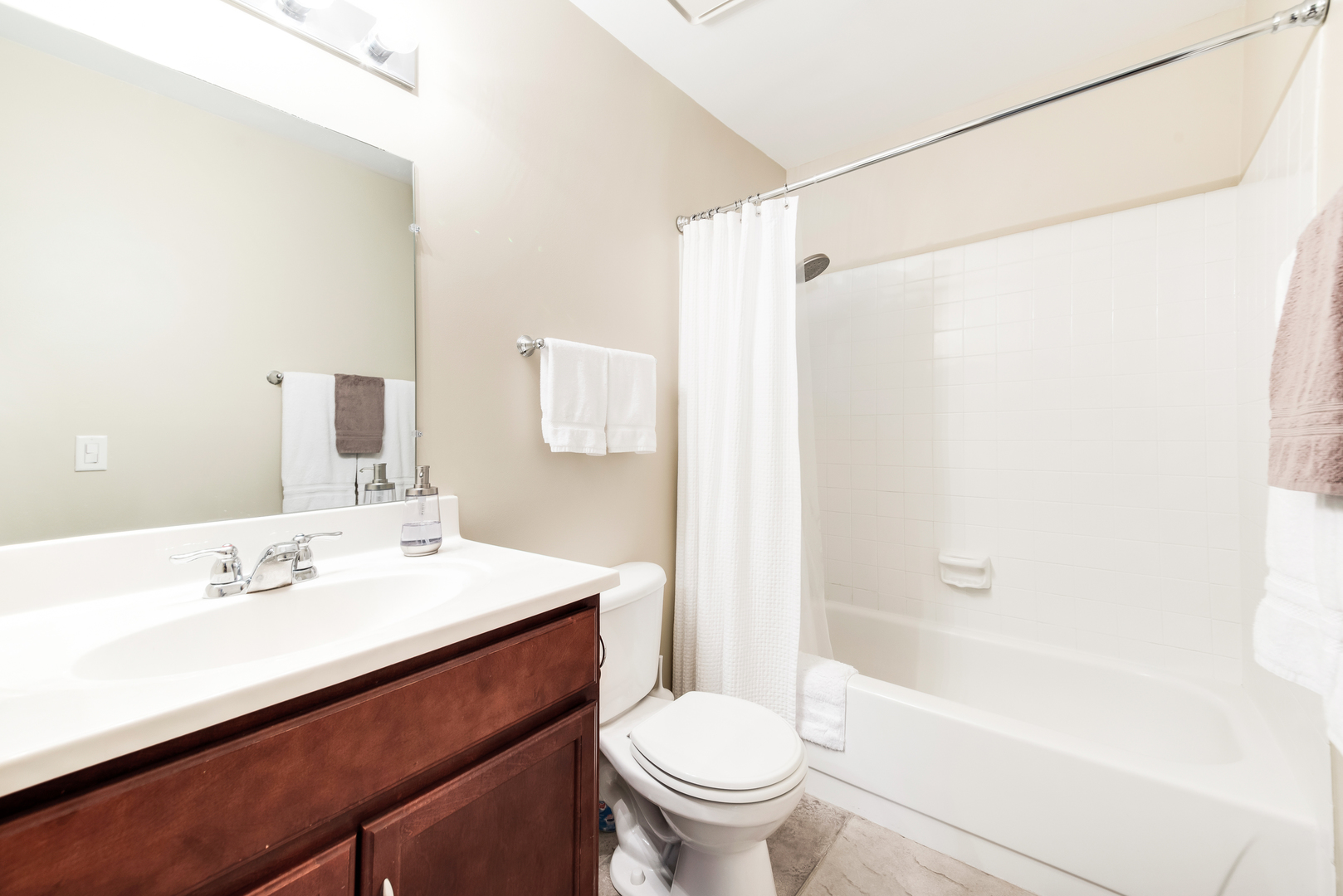 1364 McDowell Road, Unit 103 Naperville, IL 60563 - Photo 14 of 19 a bathroom with a sink mirror toilet and bathtub