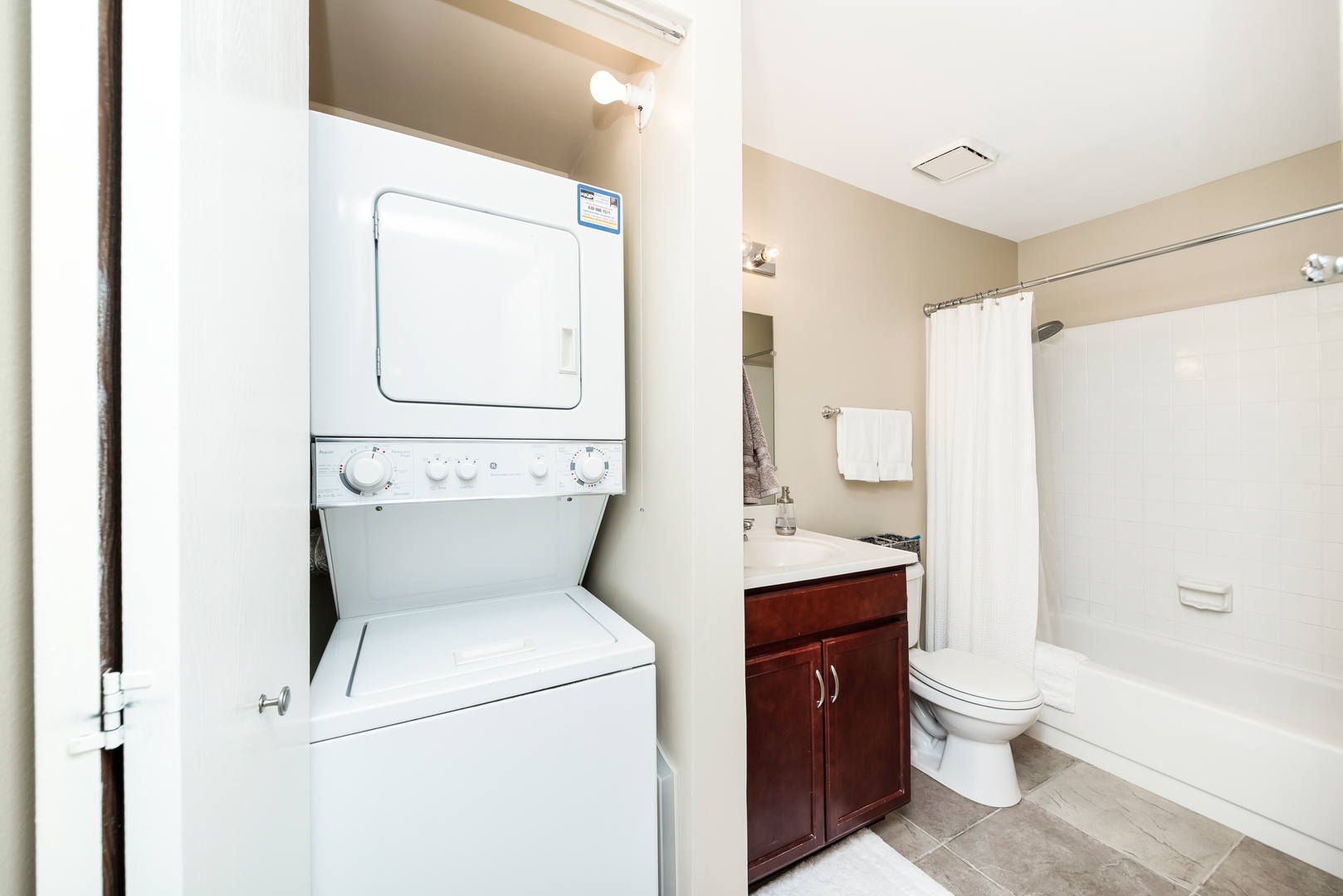 1364 McDowell Road, Unit 103 Naperville, IL 60563 - Photo 15 of 19 a bathroom with a toilet sink shower and mirror