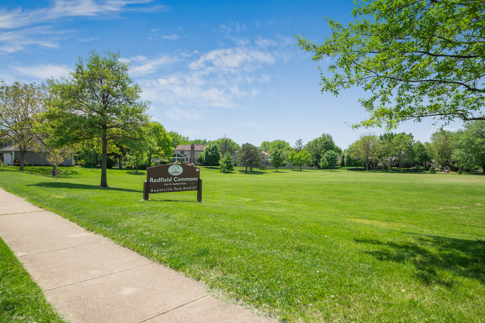 1364 McDowell Road, Unit 103 Naperville, IL 60563 - Photo 18 of 19 a park view with a bench in garden