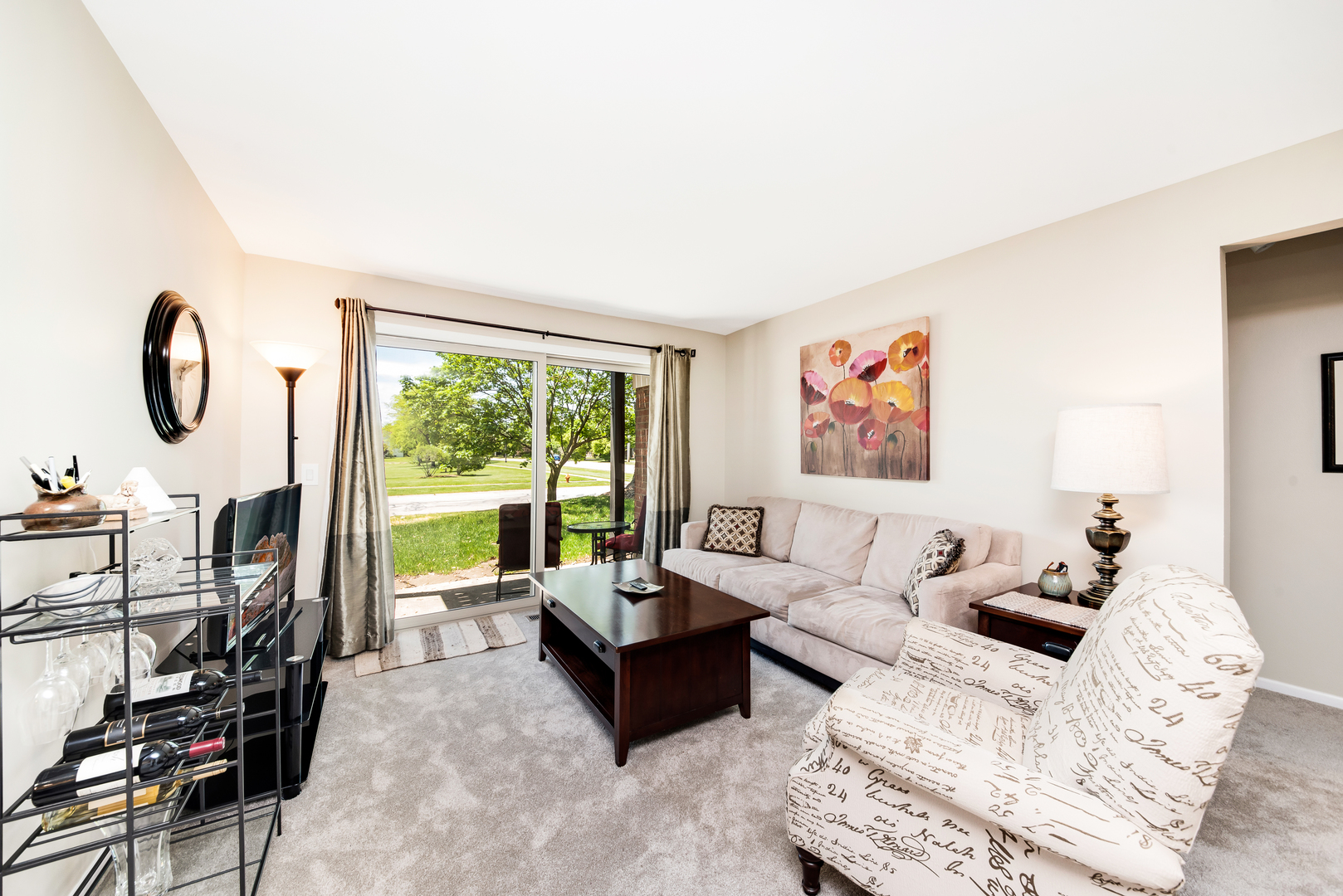 1364 McDowell Road, Unit 103 Naperville, IL 60563 - Photo 10 of 19 a living room with furniture a floor to ceiling window and a flat screen tv