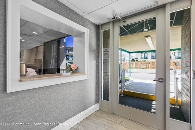 a lobby with furniture and a table